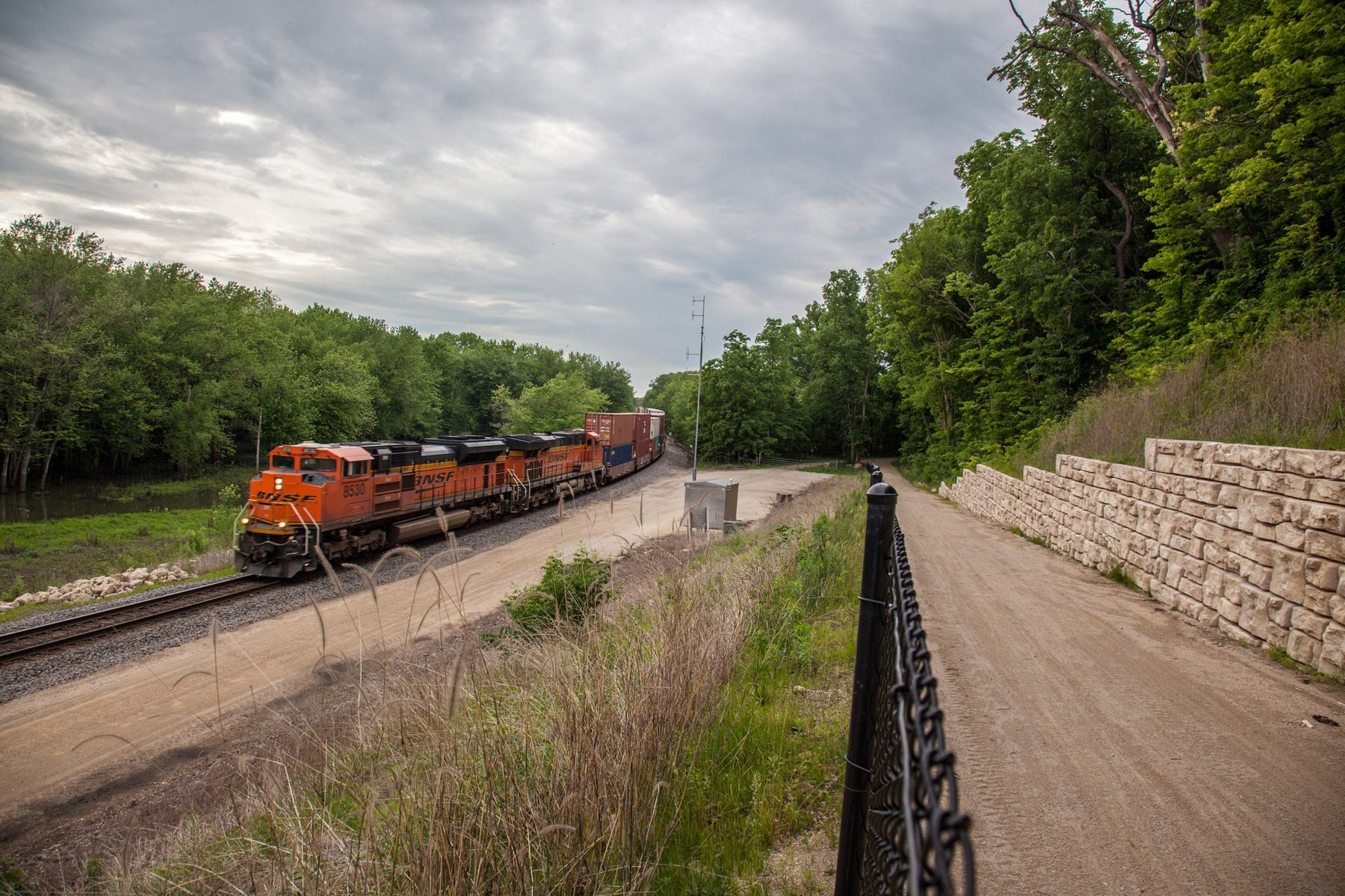 A train moving along the tracks parallel to the Galena River Trail.