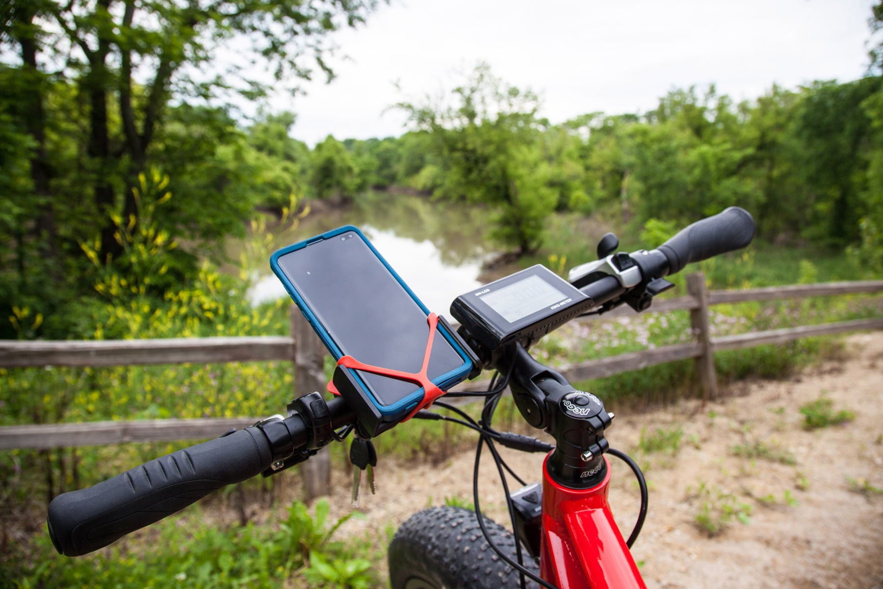 A Nuts Outdoors rental e-bike with a phone mount looking out over the Galena River.